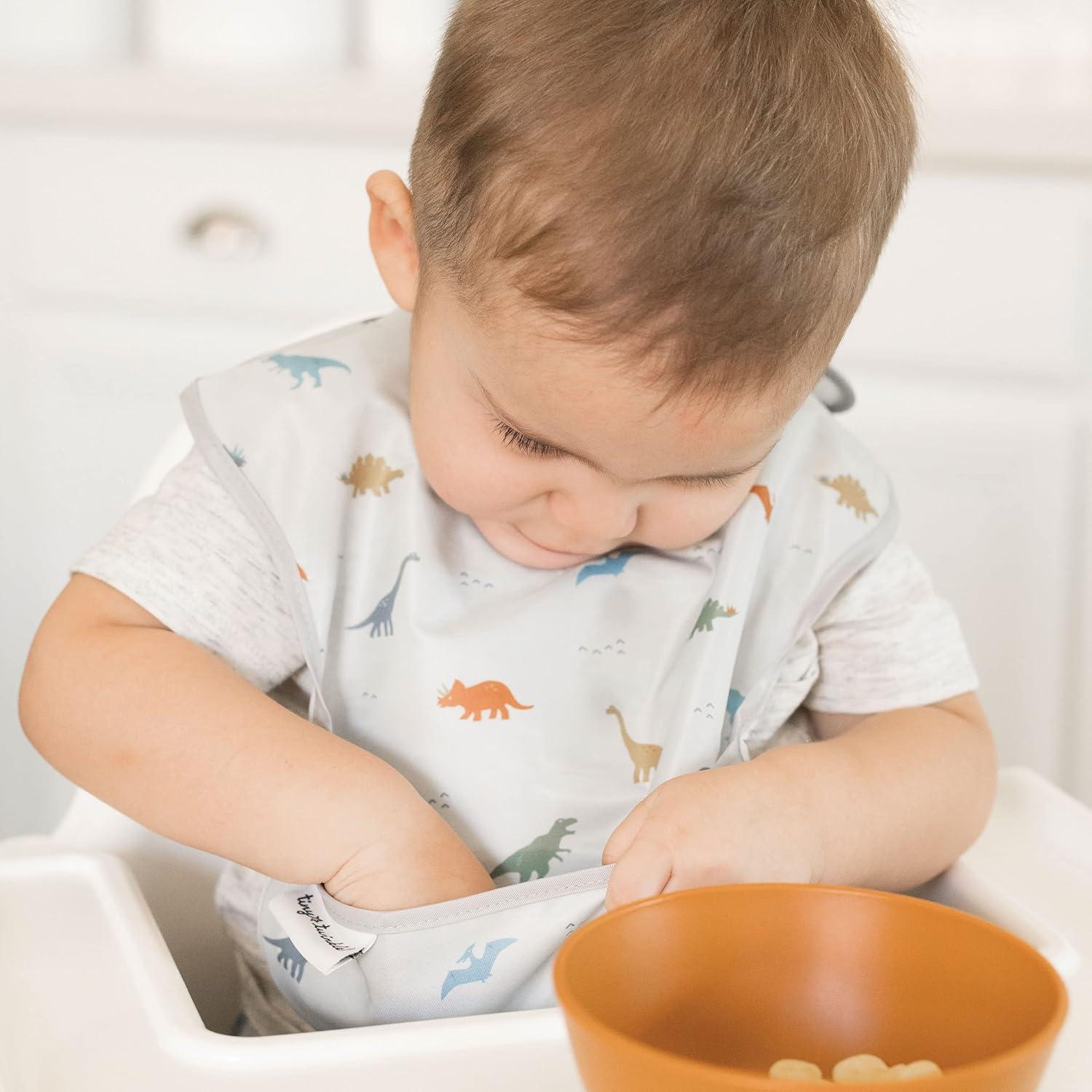 image:imageTiny Twinkle MessProof Baby Bibs for Eating Waterproof Wipeable Toddler Bibs with CatchAll Pocket Feeding Bibs for Girls amp Boys3 PackCowboy3pack Dinosaur